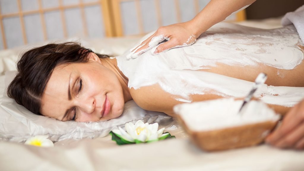 lady taken body treatment lape apply on body